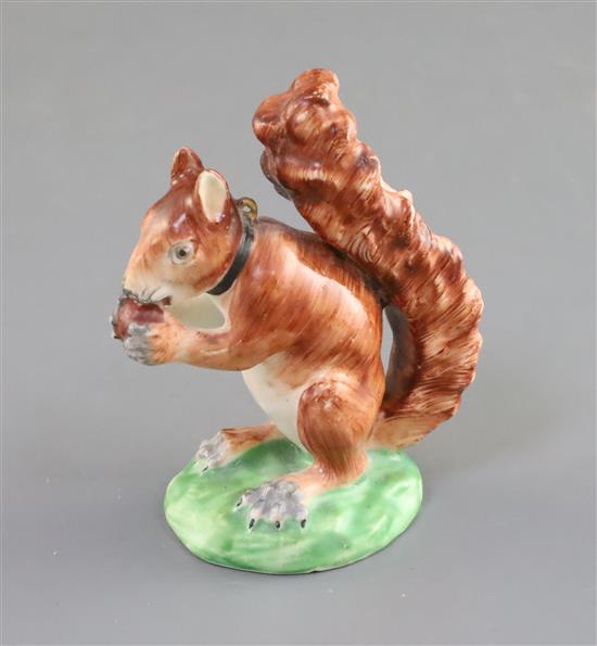 A Derby porcelain figure of a red squirrel, c.1800-30, H. 8.7cm, restoration to ears